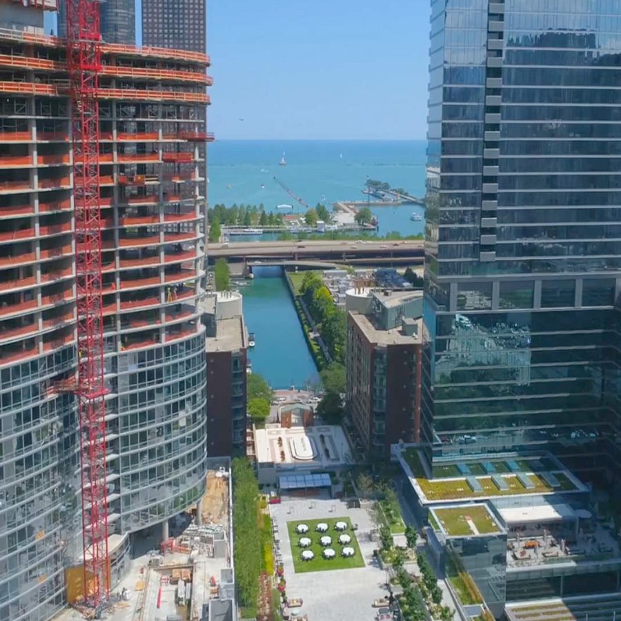 Lakefront high-rise under construction, representing On Collective.