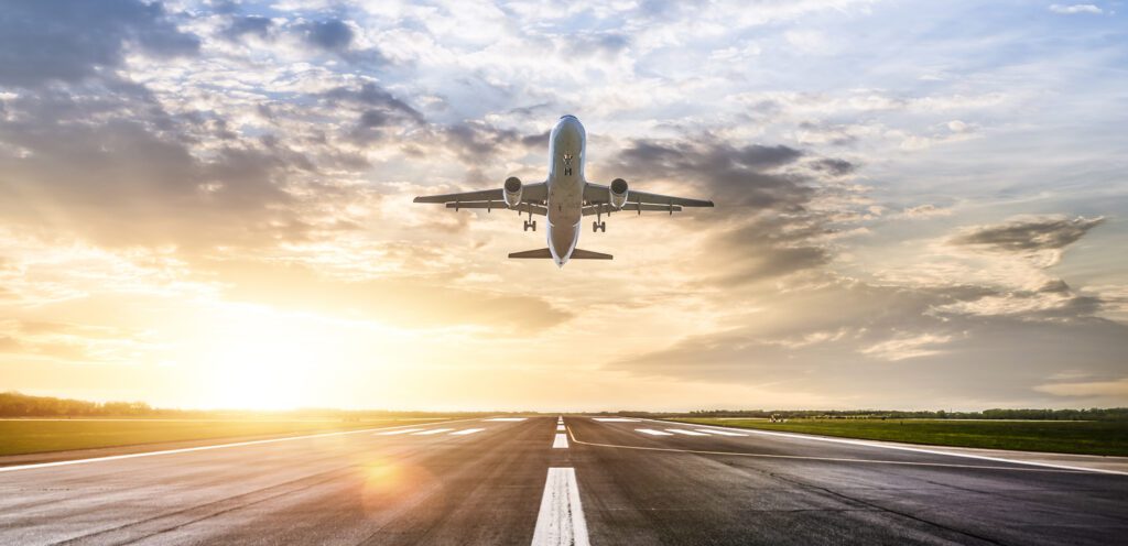 Passenger airplane taking of at sunrise. Passenger airplane taking of at sunrise.