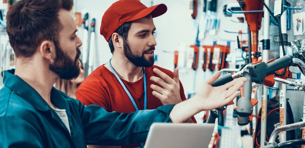 Salesmen check power tools inventory.