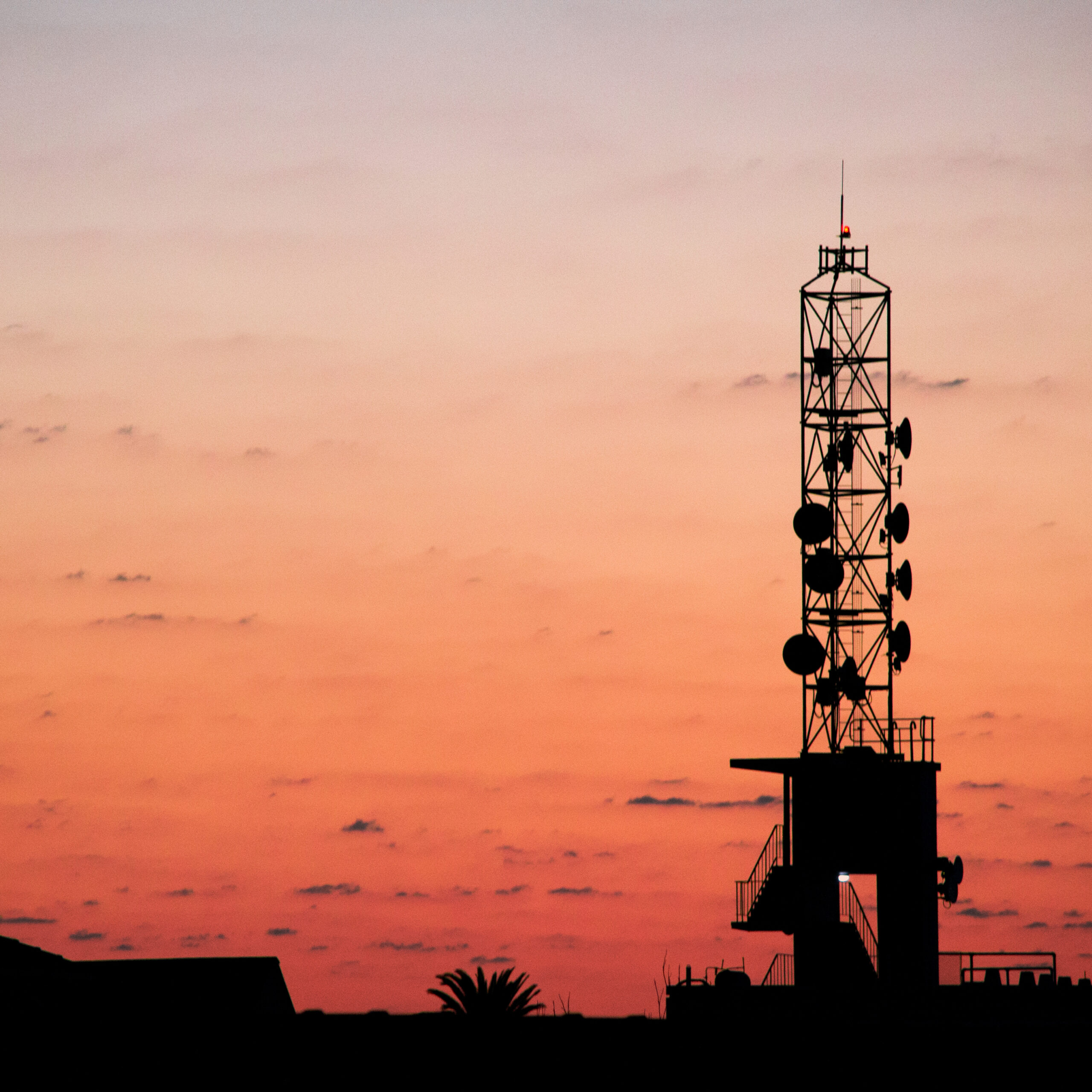 Cell tower at sunset representing African Development Fund.