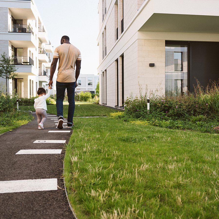 Parent and child at apartment representing the Woodlawn Central real estate development.