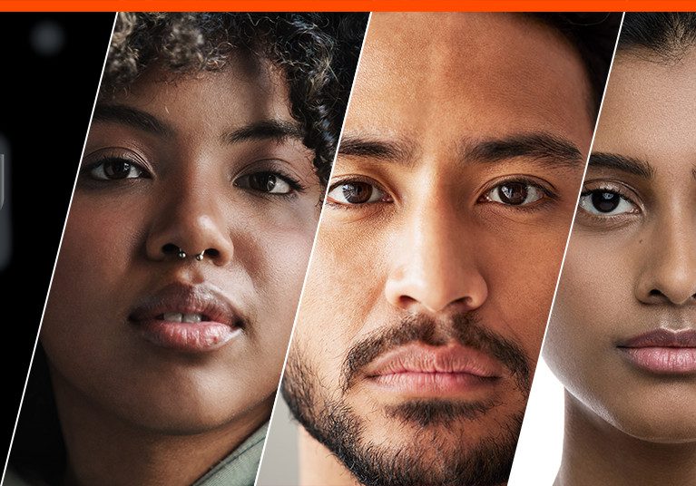 Three people look directly ahead.