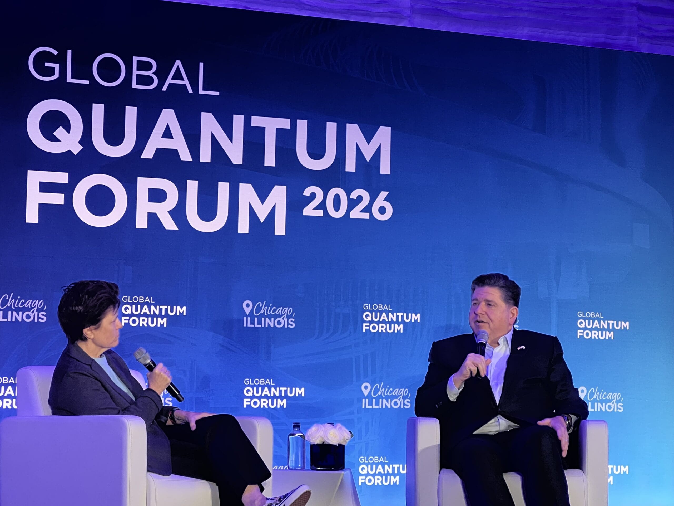 Kara Swisher interviews Illinois Gov. J.B. Pritzker on stage, against backdrop reading 2026 Global Quantum Forum.